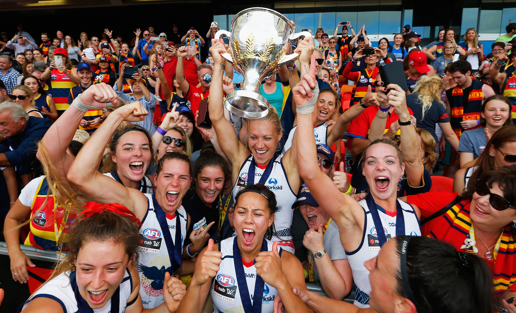 Triumphant Crows after the first AFLW Grand Final. (Co-captain Chelsea Randall third from left.) Images: AFL Media